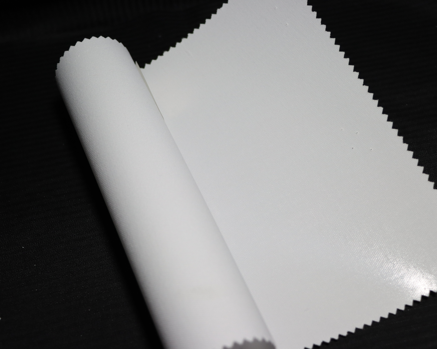 white color sample of Arabic thobe interlining on dark background