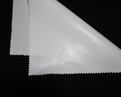 Close-up of an IF3903 white  interlining material sample on a black background