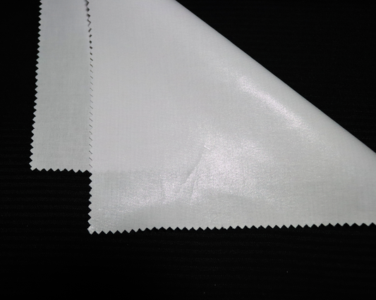 Close-up of an IF3903 white  interlining material sample on a black background