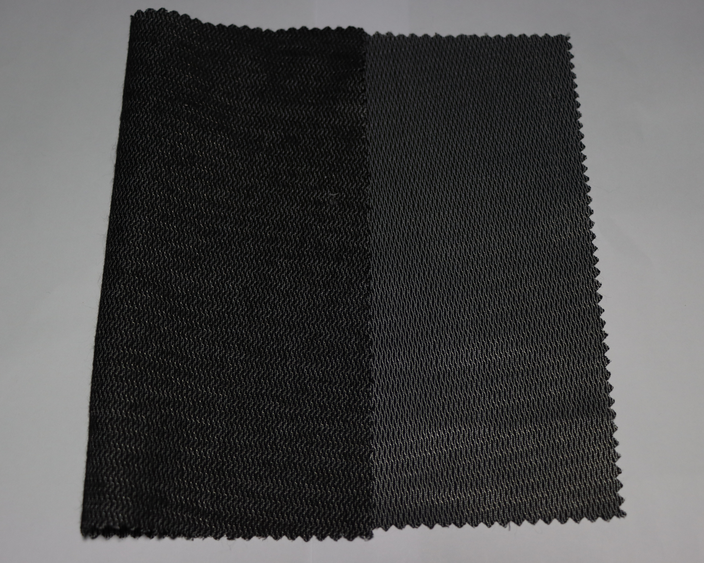 black colour men's coat interlining sample on a white background