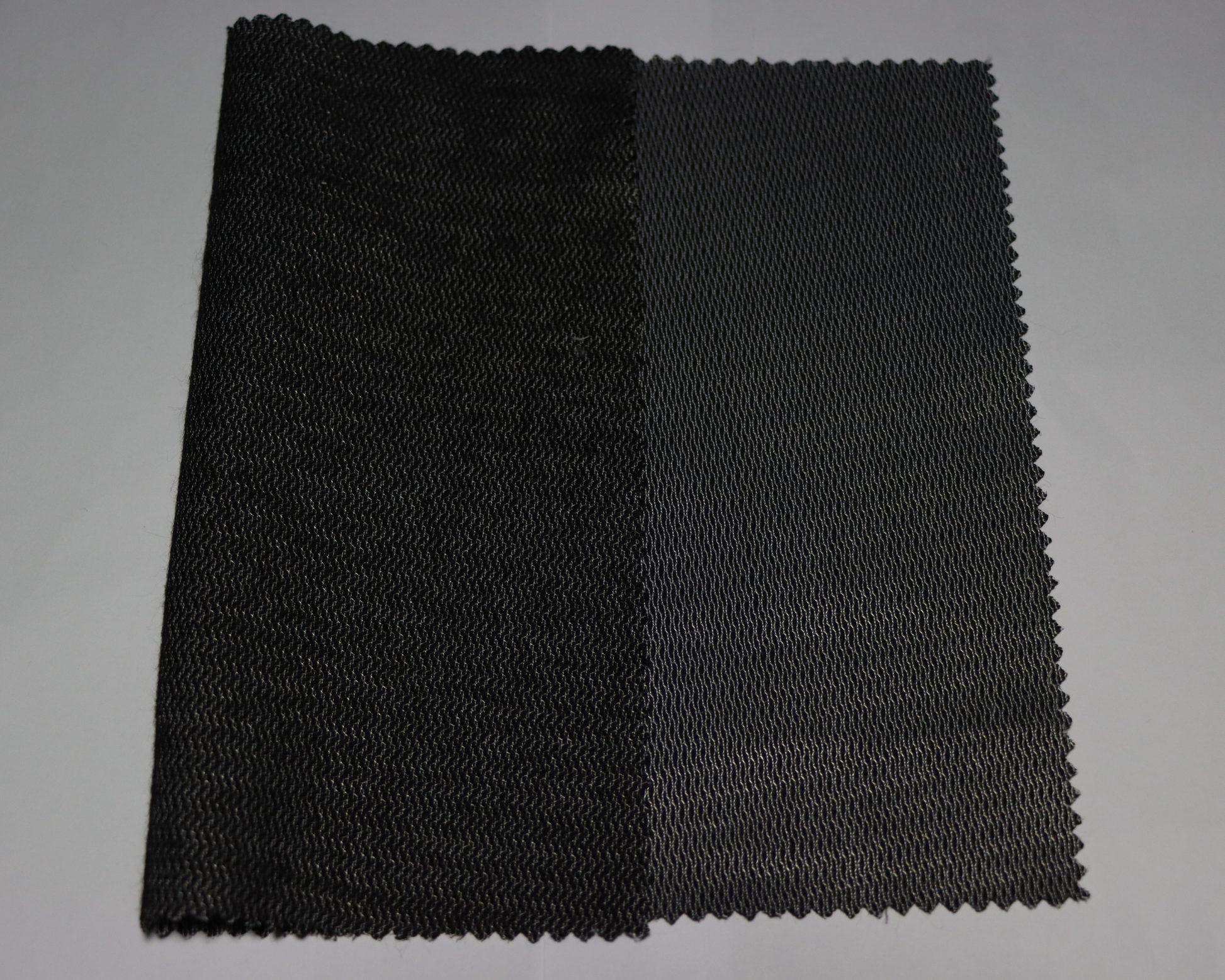 black colour men's coat interlining sample on a white background