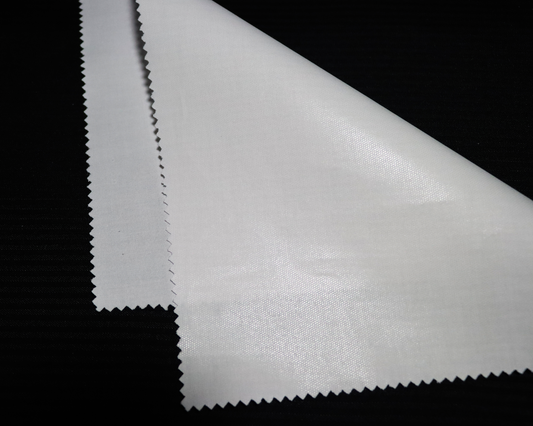 Close-up of IF84 Arabic thobe interlining fabric on a black background