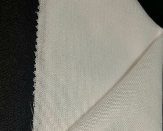 biege color sample of jacket interlining on black background