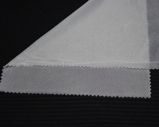 sample of 4-way stretch interlining on black background