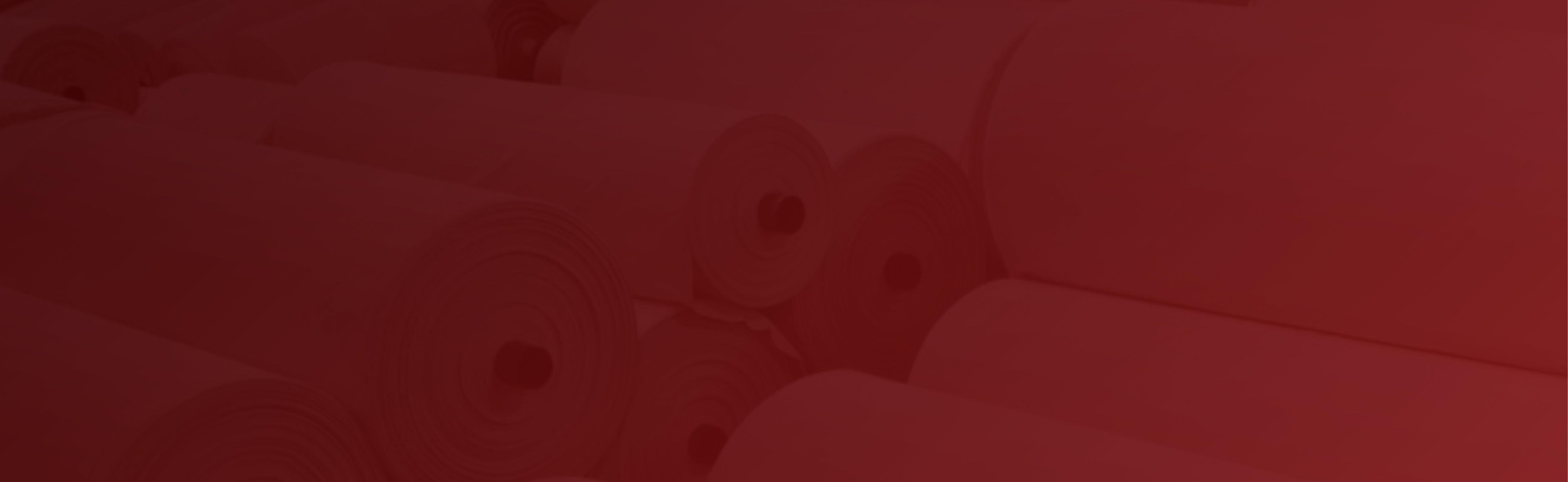 Close-up of rolls of interlinings stacked together on 